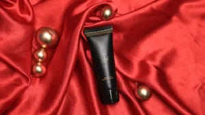 Close-up of hands applying Slyd Lube — demonstration of correct vaginal lubricant application for safe, smooth intimacy